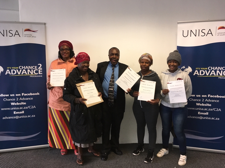 Participants from C2A Alexandra programme showcasing their certificates 